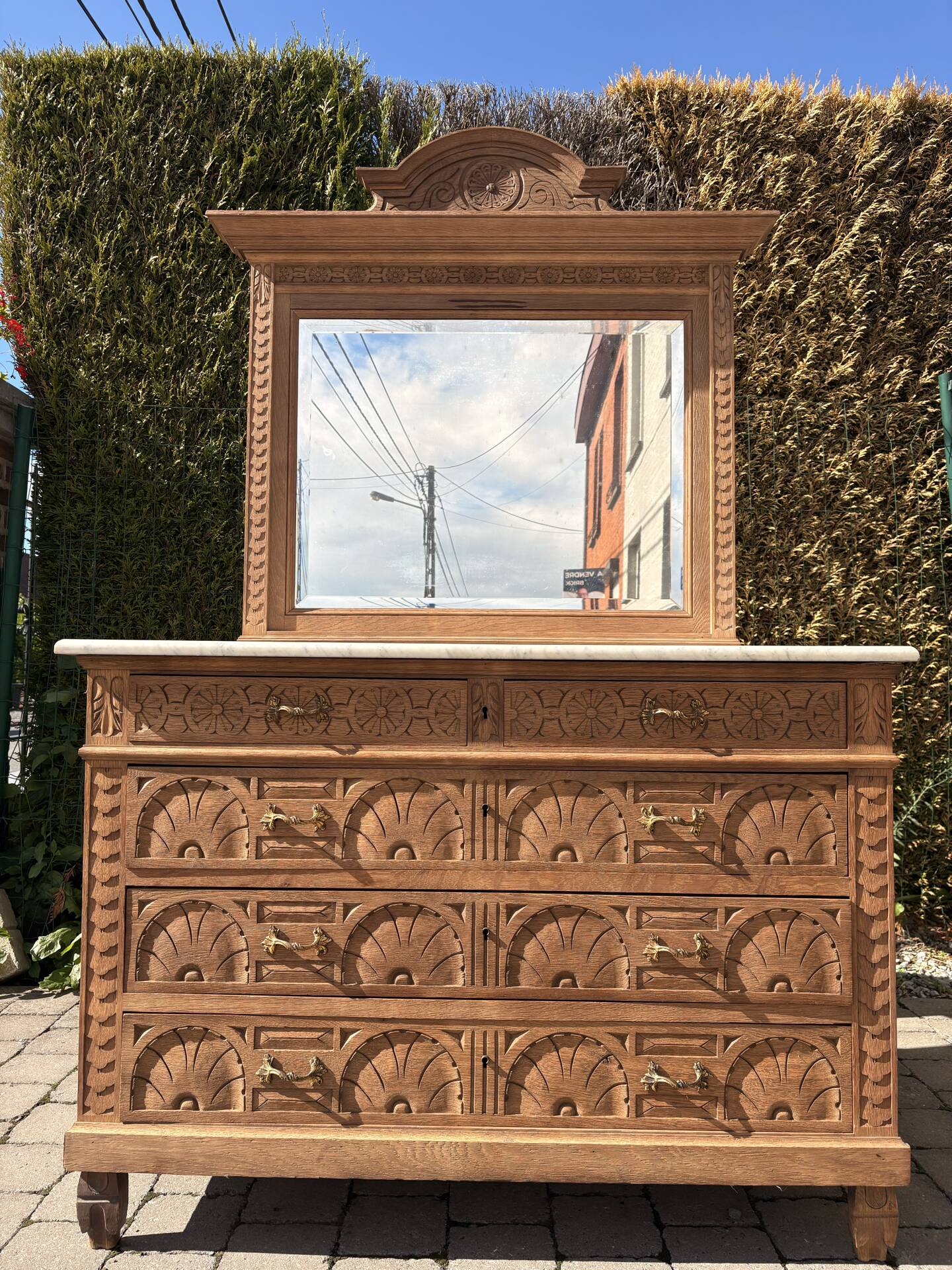 Solid oak chest of drawers with a marble top and original mirror.