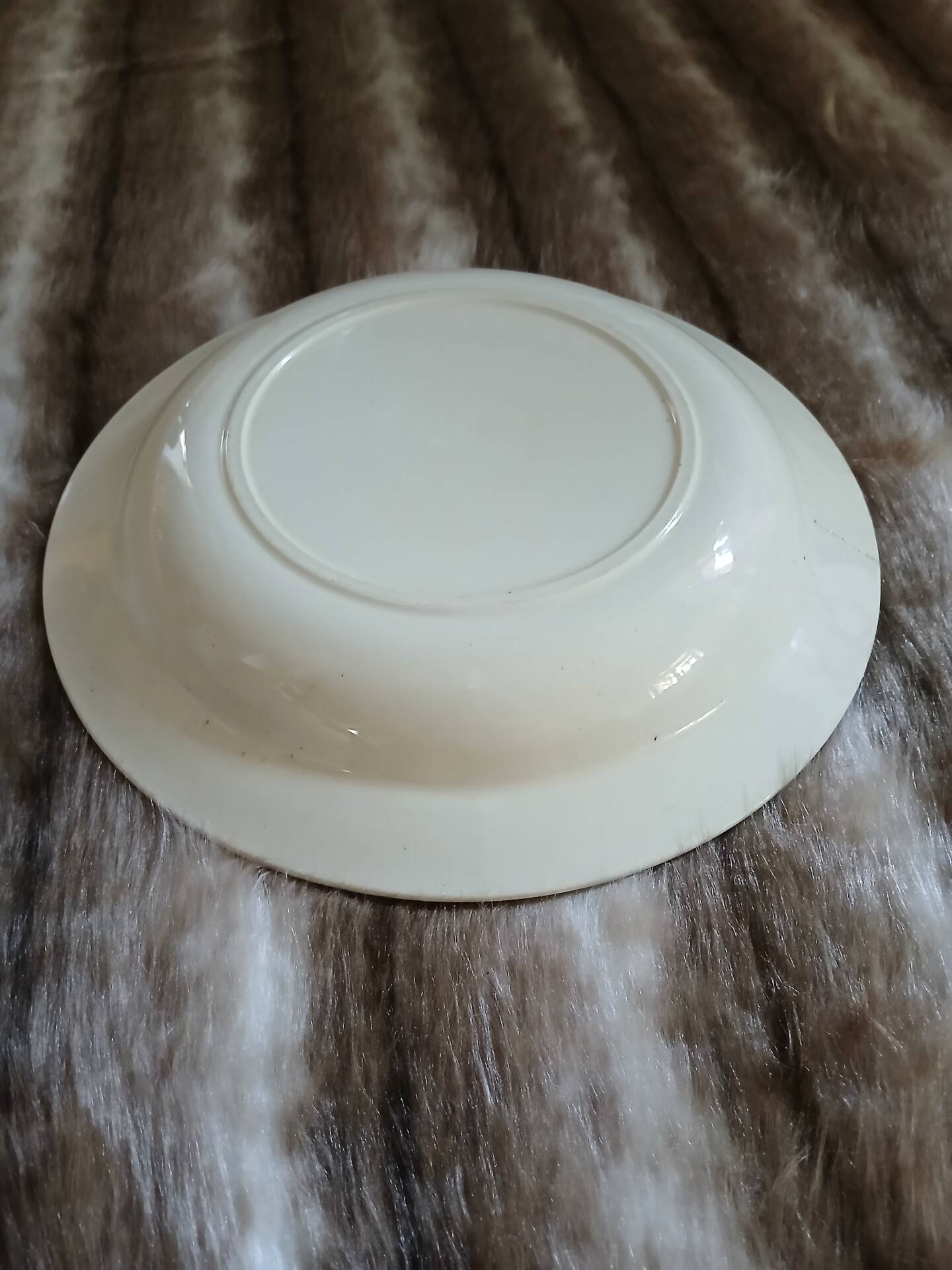 Old hollow dish made of Salins ironstone.