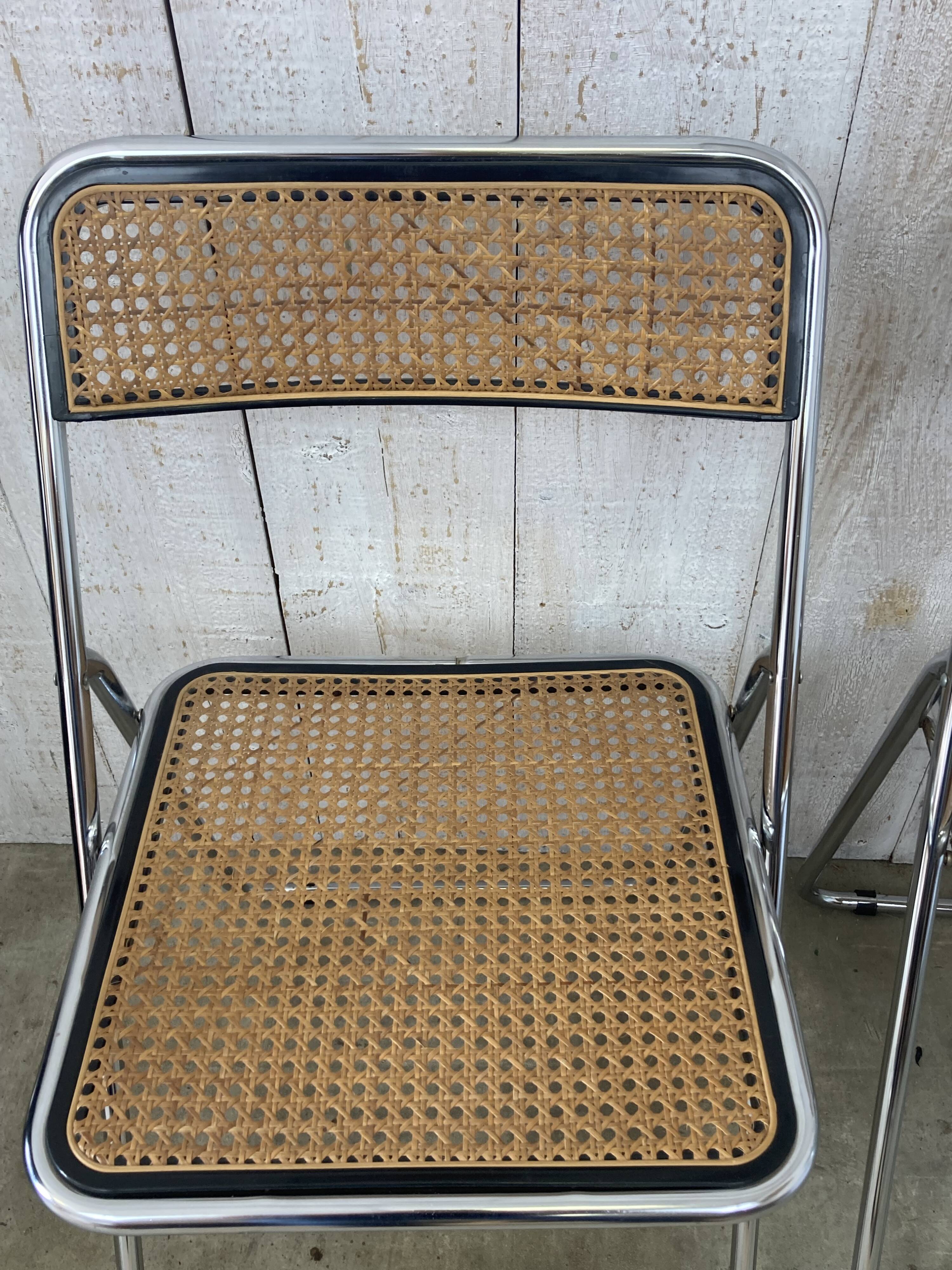 Pair of chrome and cane folding chairs