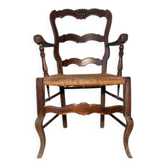 Antique Provencal armchair in carved wood with straw seat