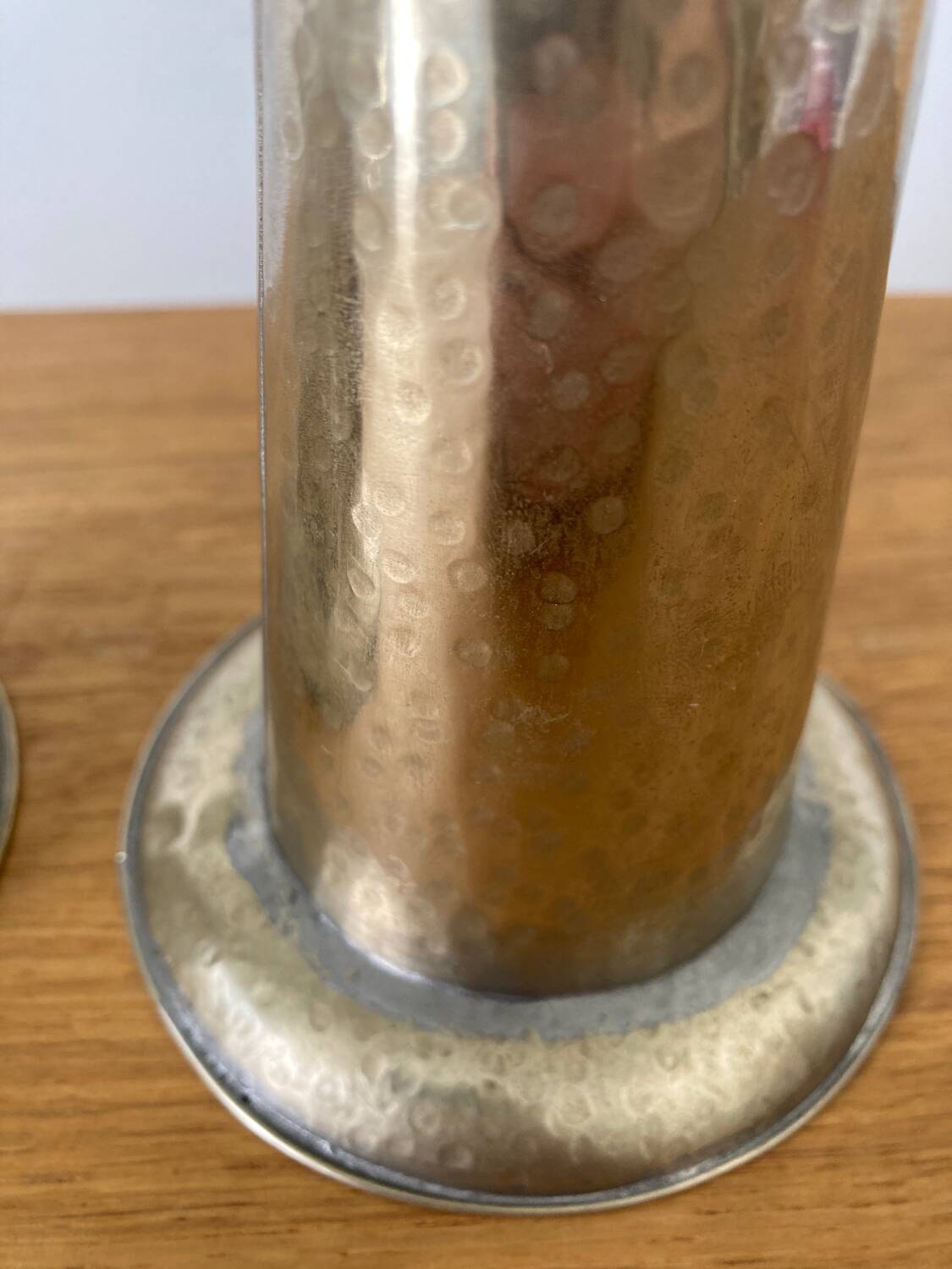 Pair of hammered metal candlesticks