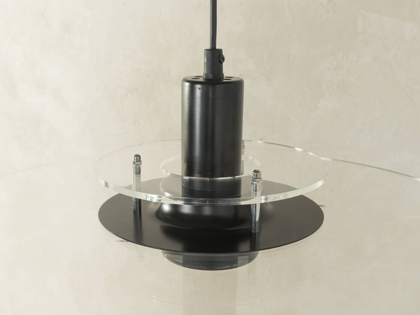 Space Age ceiling lamp by Ikea from the 1980s with two plexiglass plates and canopy made of black injection-moulded plastic.