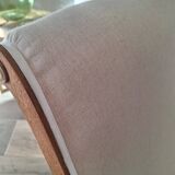 Vintage gondola armchair in beige linen fabric.