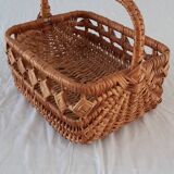 Old wicker basket with diamond-shaped decorations