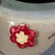 Superb handcrafted pottery pot with relief flowers signed on the back.
