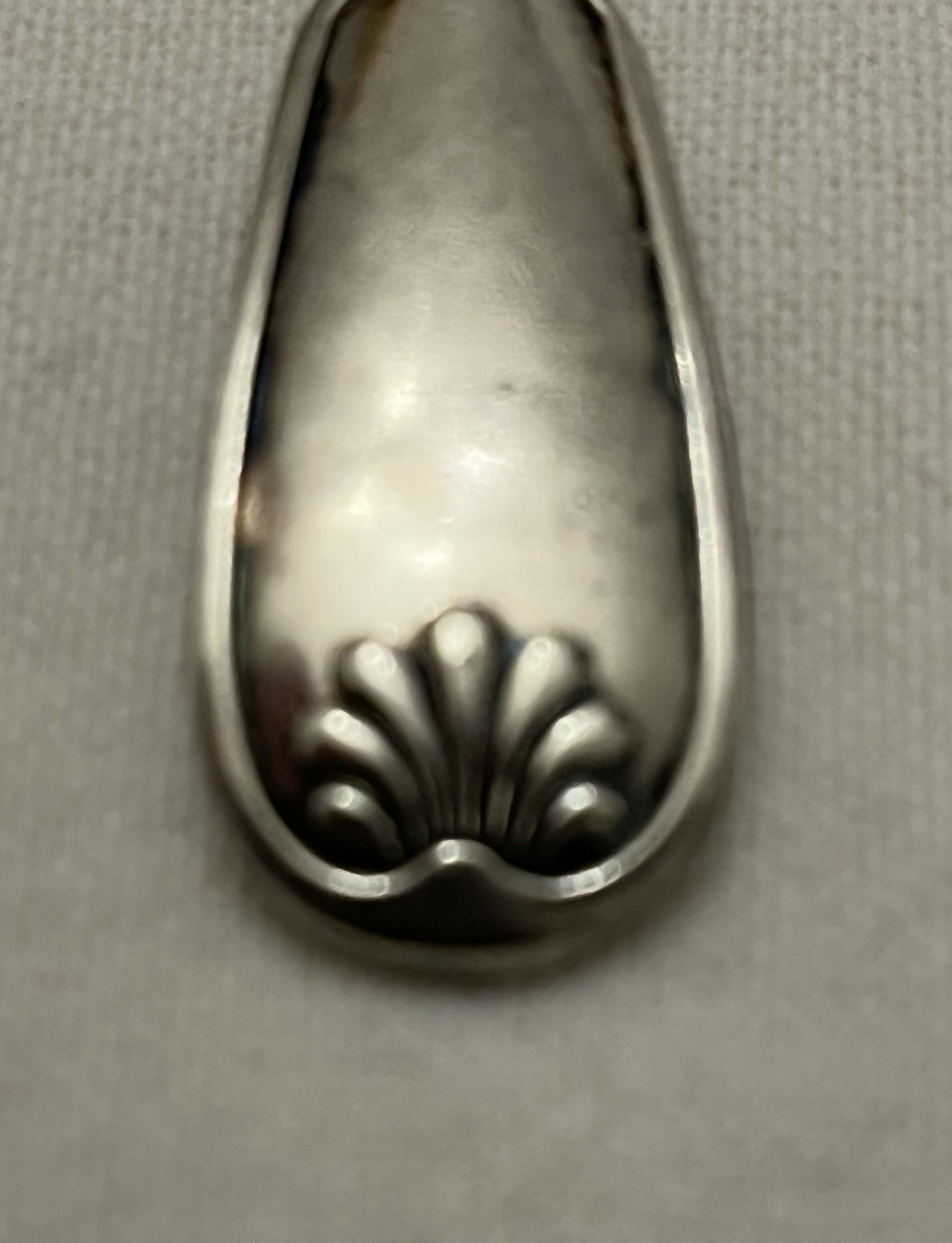 Silver metal sauce spoon