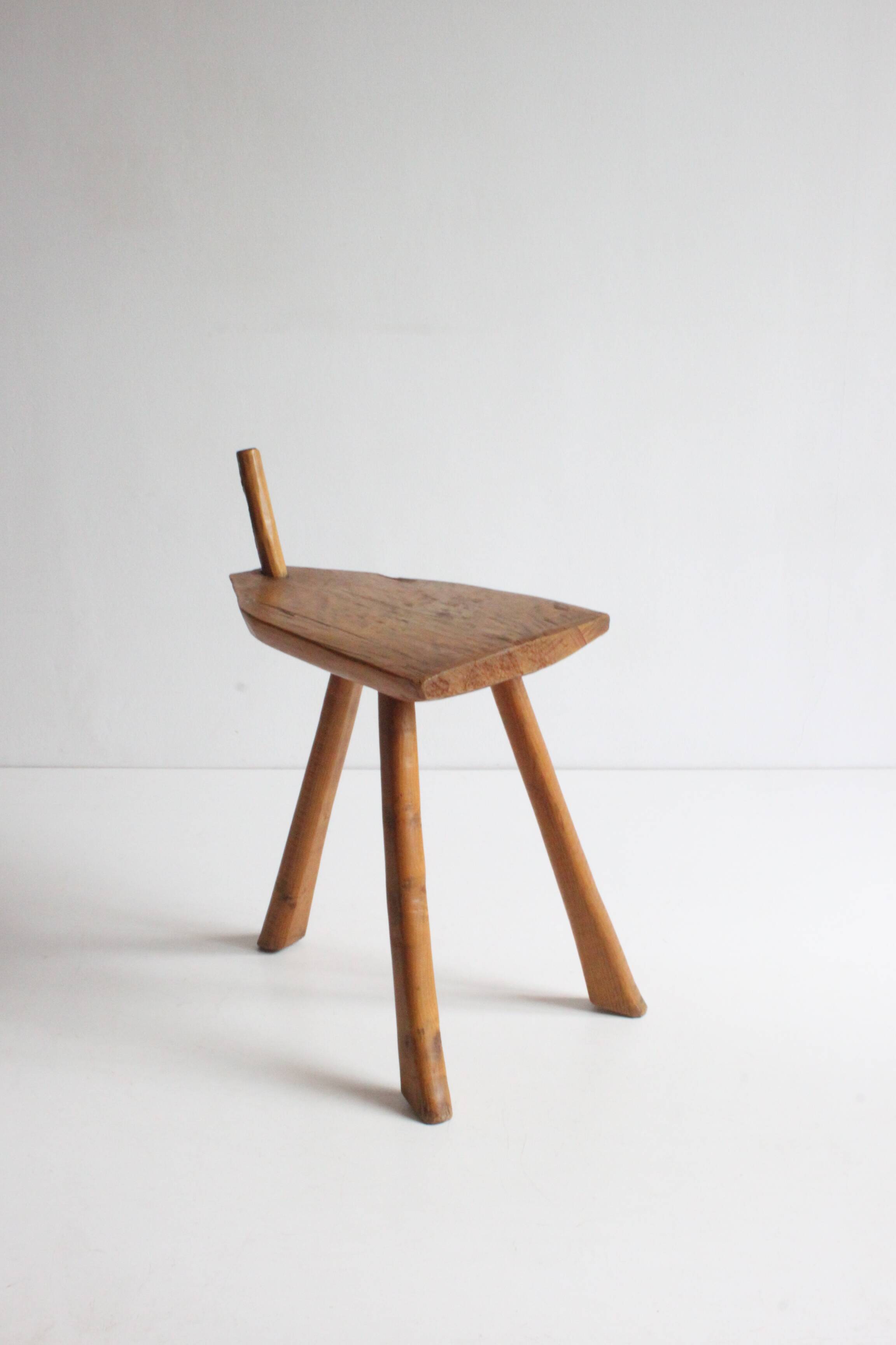 Brutalist tripod stool in carved wood, 1950s