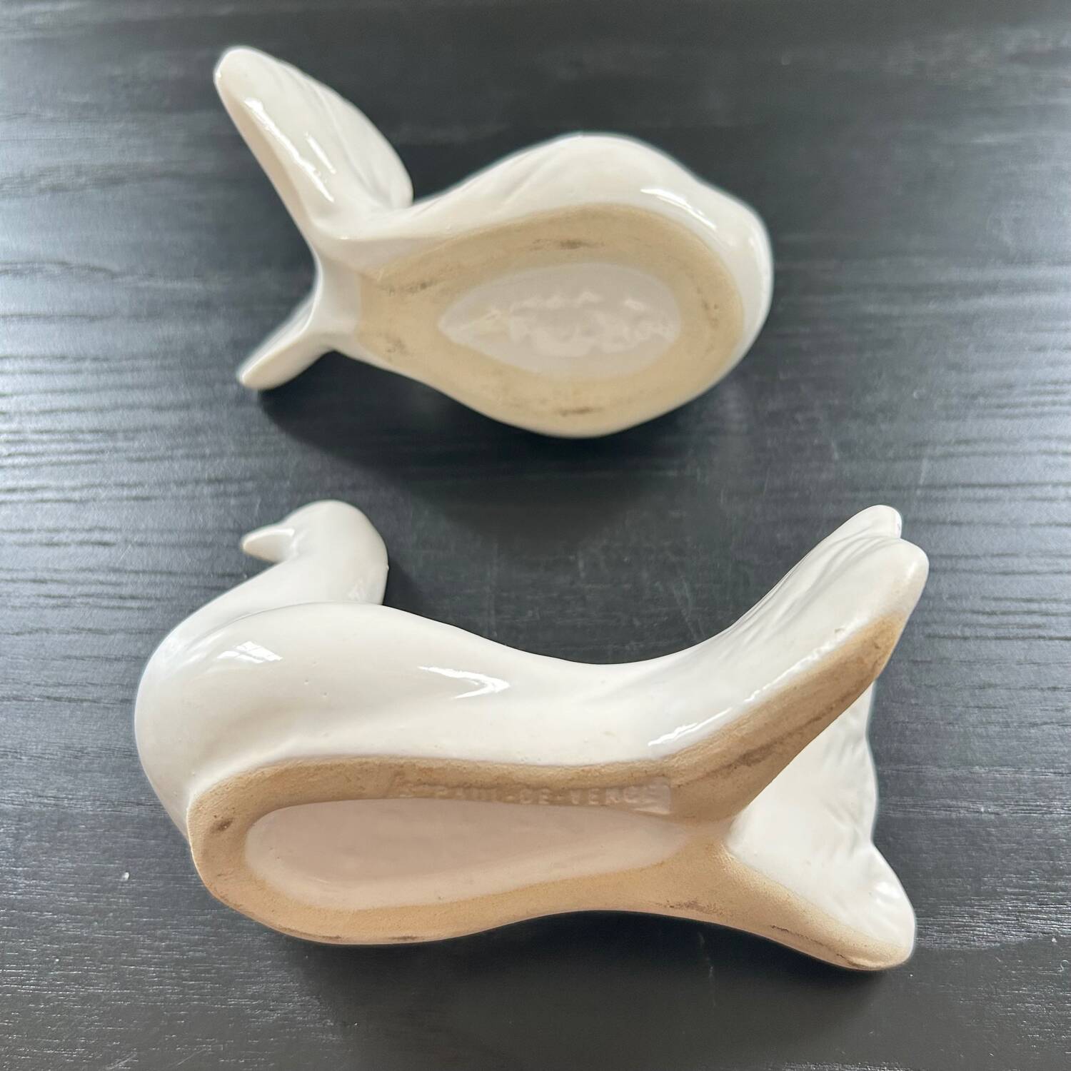 Duo of doves pecking flowers