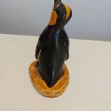 Small plaster penguin statue