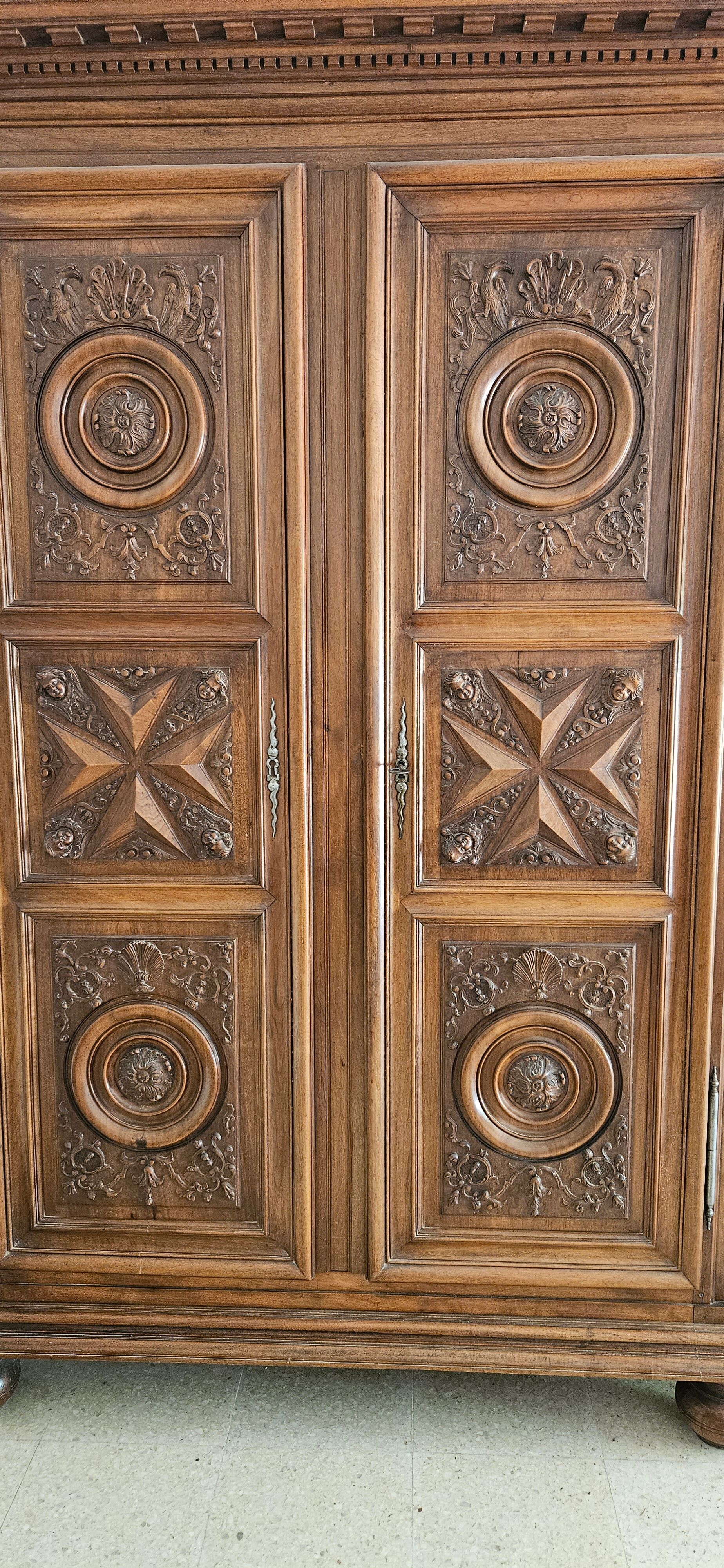 Carved cherubs cabinet