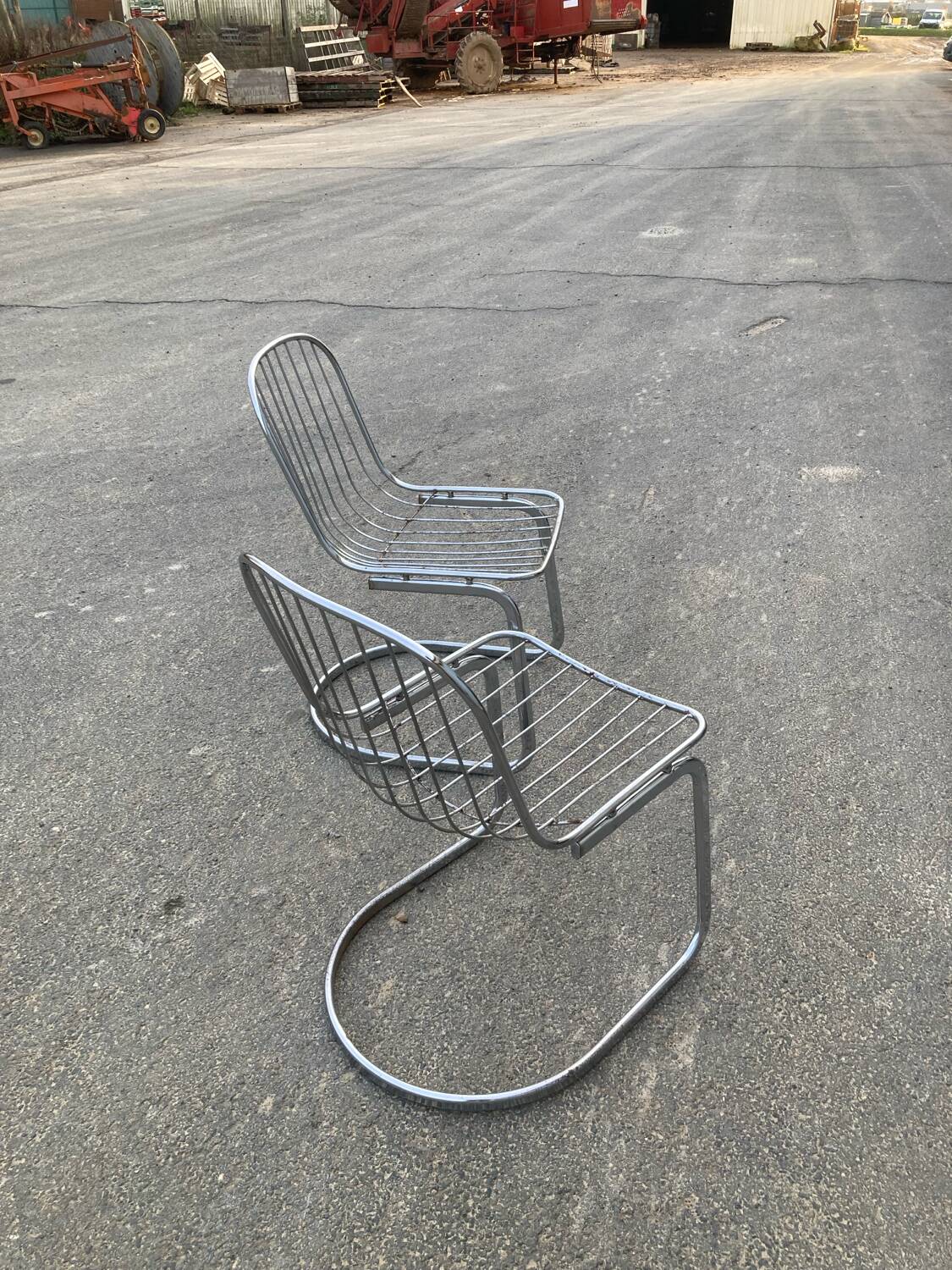 Two Gastone Rinaldi style chrome metal chairs.