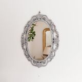 Louis XVI style patinated oval mirror