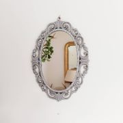 Louis XVI style patinated oval mirror