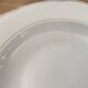 Set of 6 deep plates in fine porcelain from Bohemia with a gold rim.