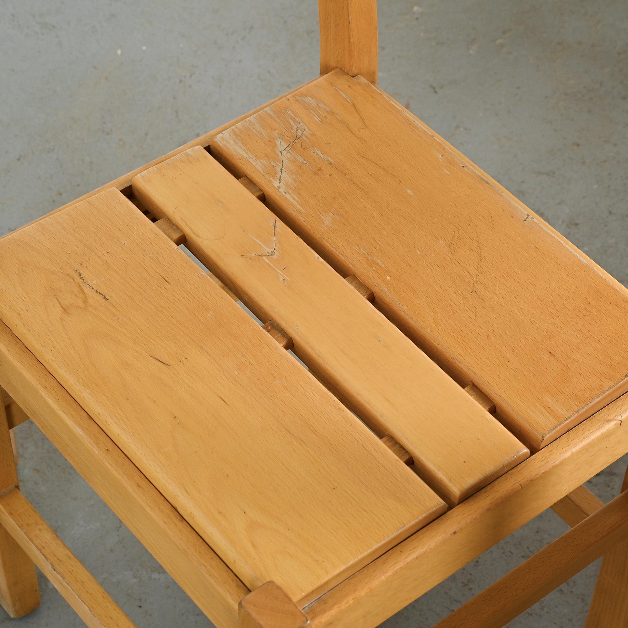 Set of six solid pine chairs by Maison Regain.
