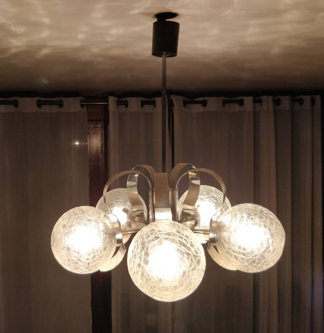 Vintage chandelier with glass globes and chrome steel