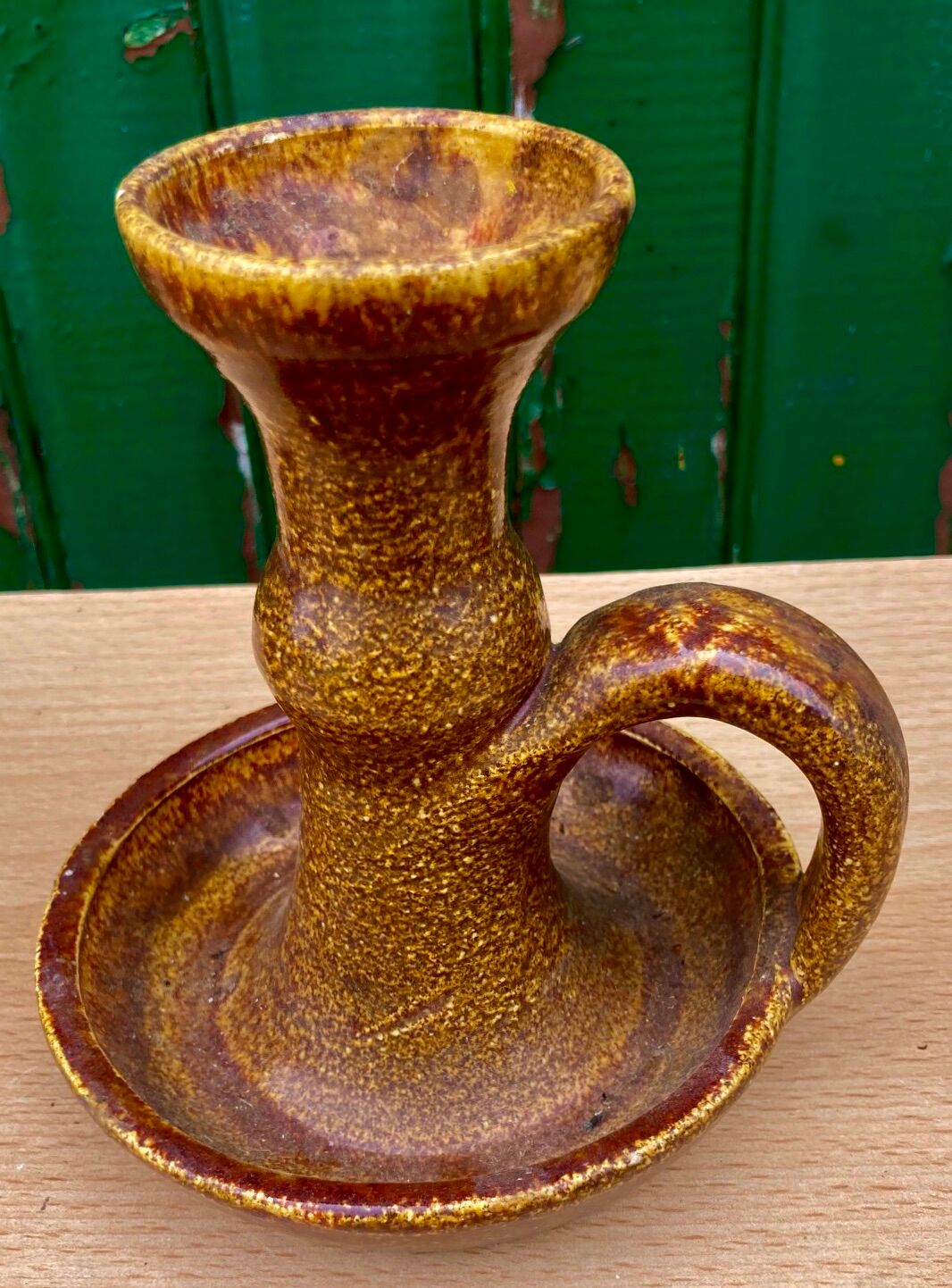 Candle holder in old earthenware signed by the 2 glued aa of the Accolay factory