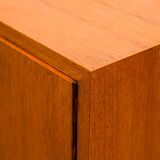 Highboard in teak wood with grooved doors,