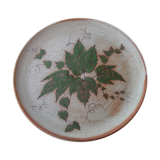 Round dish in gres a decor of leaves sign in calcat
