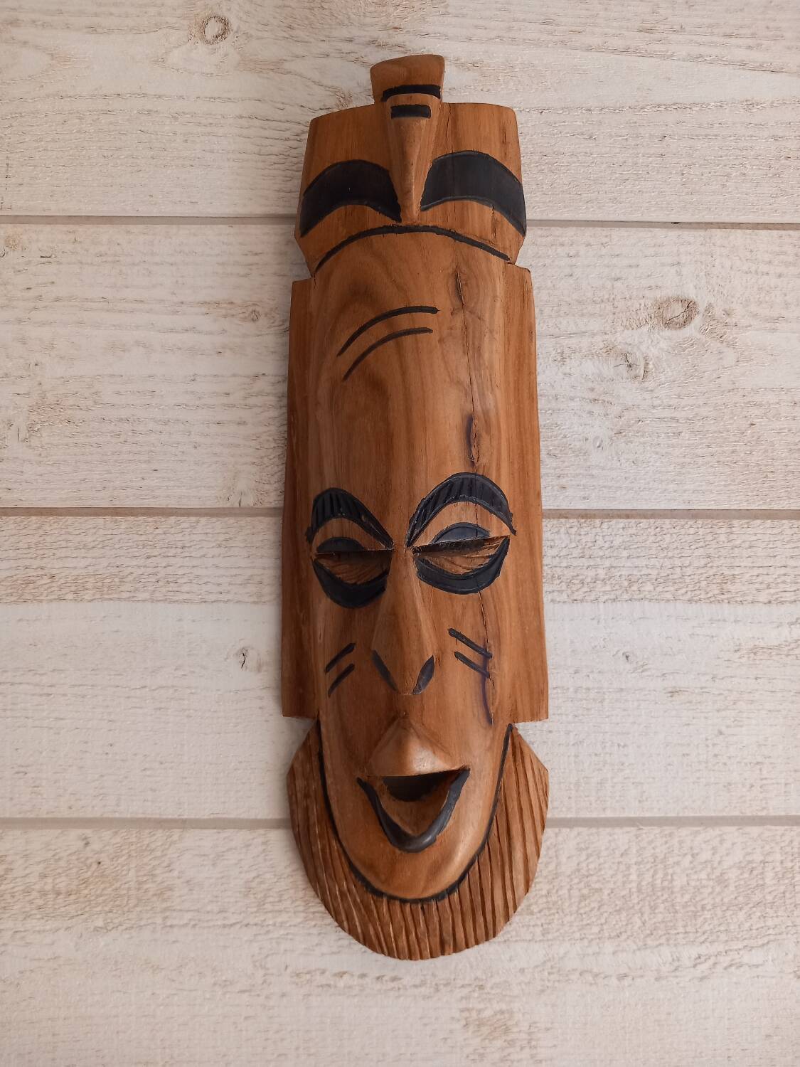 African mask in light wood