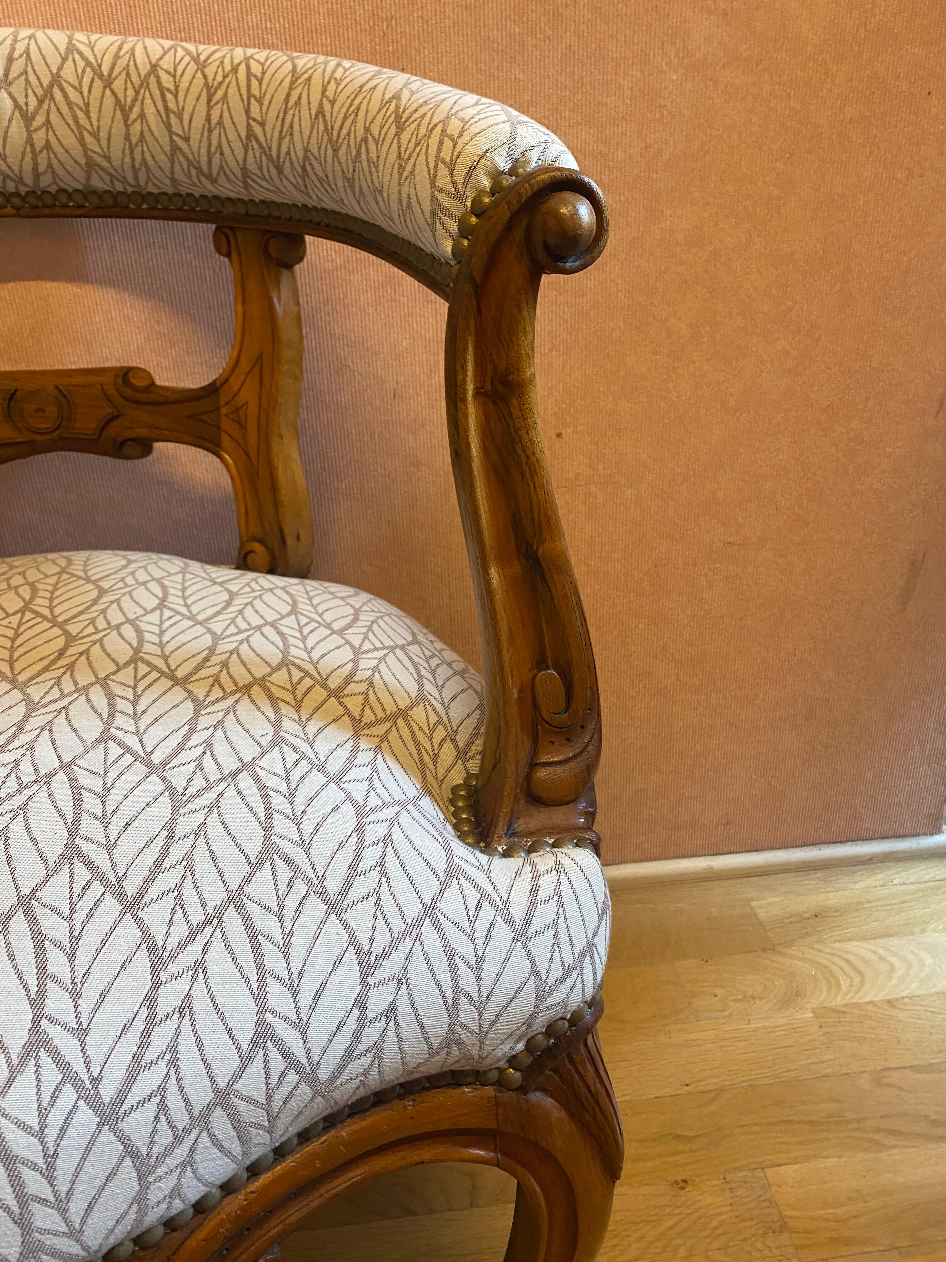 office armchair in walnut, nineteenth century, fully trimmed and reupholstered.