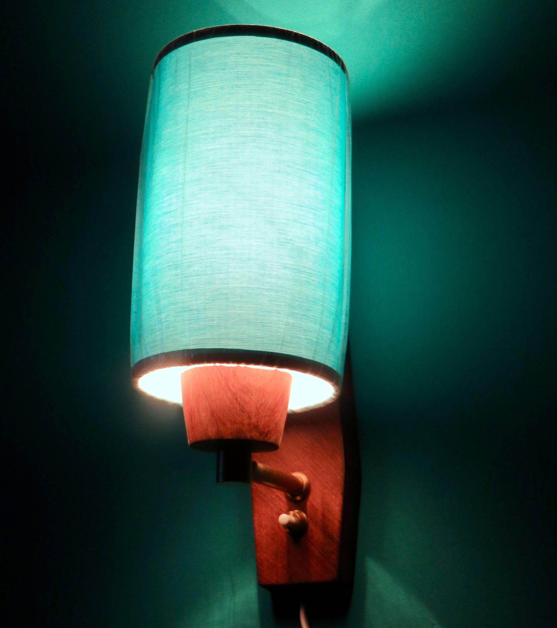 Pair of "Vitrika" rosewood wall sconces with turquoise shades. Denmark, 1960