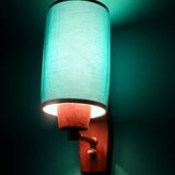 Pair of "Vitrika" rosewood wall sconces with turquoise shades. Denmark, 1960
