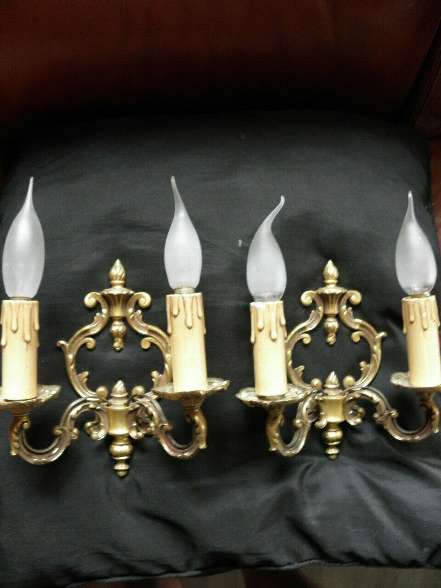 Pair of bronze double-arm appliques