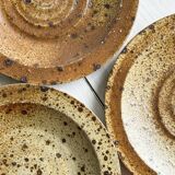 3 rustic stoneware plates, brown and beige speckled finish.
