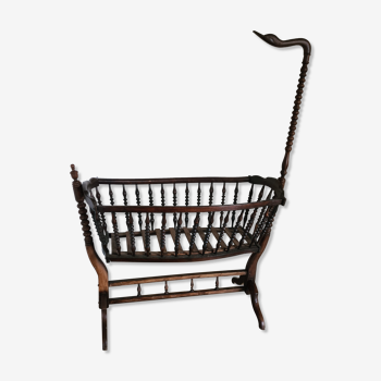 Old wooden rocking cradle twisted / vintage bars