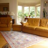 Tan leather sofa with natural graining, matching armchair and pouf