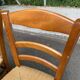 2 wooden dining chairs with rush seats from the 1970s.