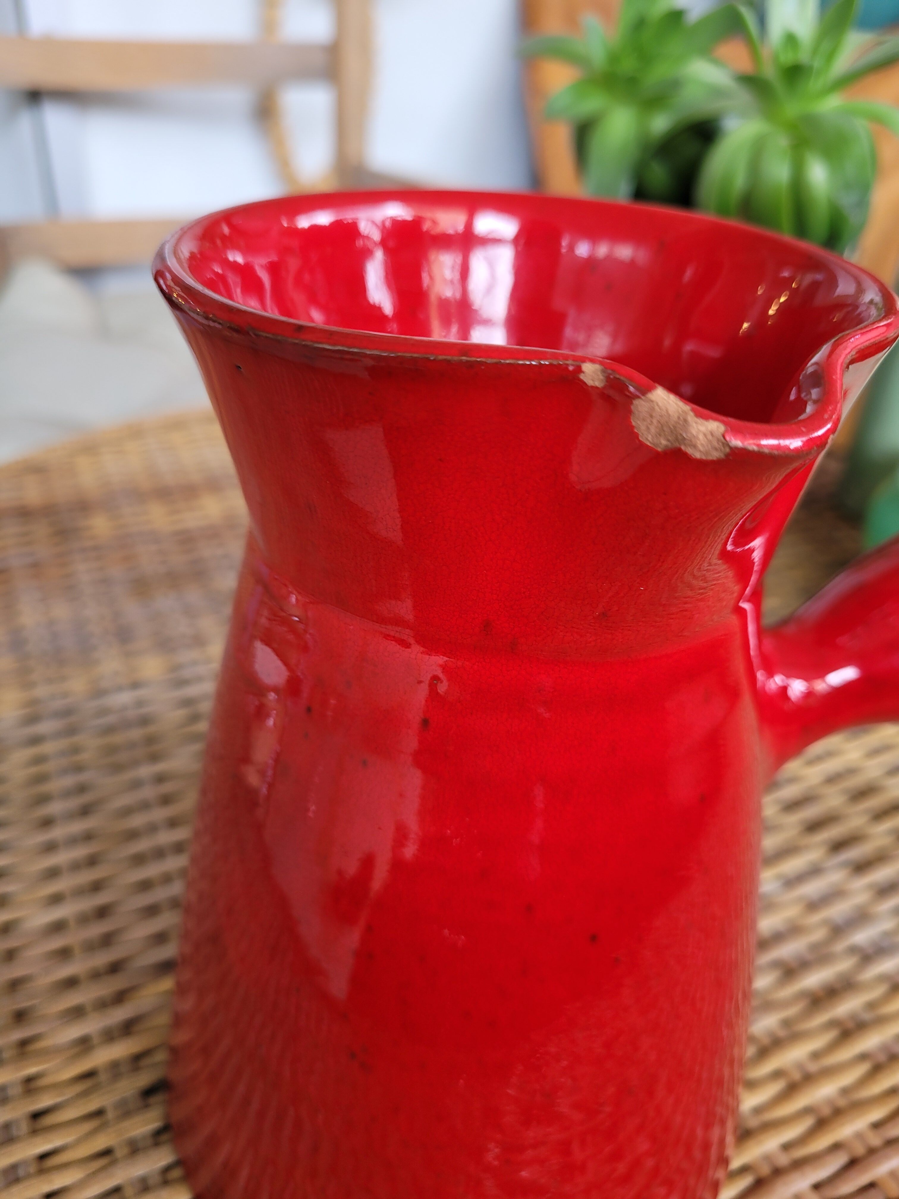 Ancient pitcher in red enamelled sandstone