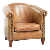 Vintage sheepskin club armchair finished with decorative nails