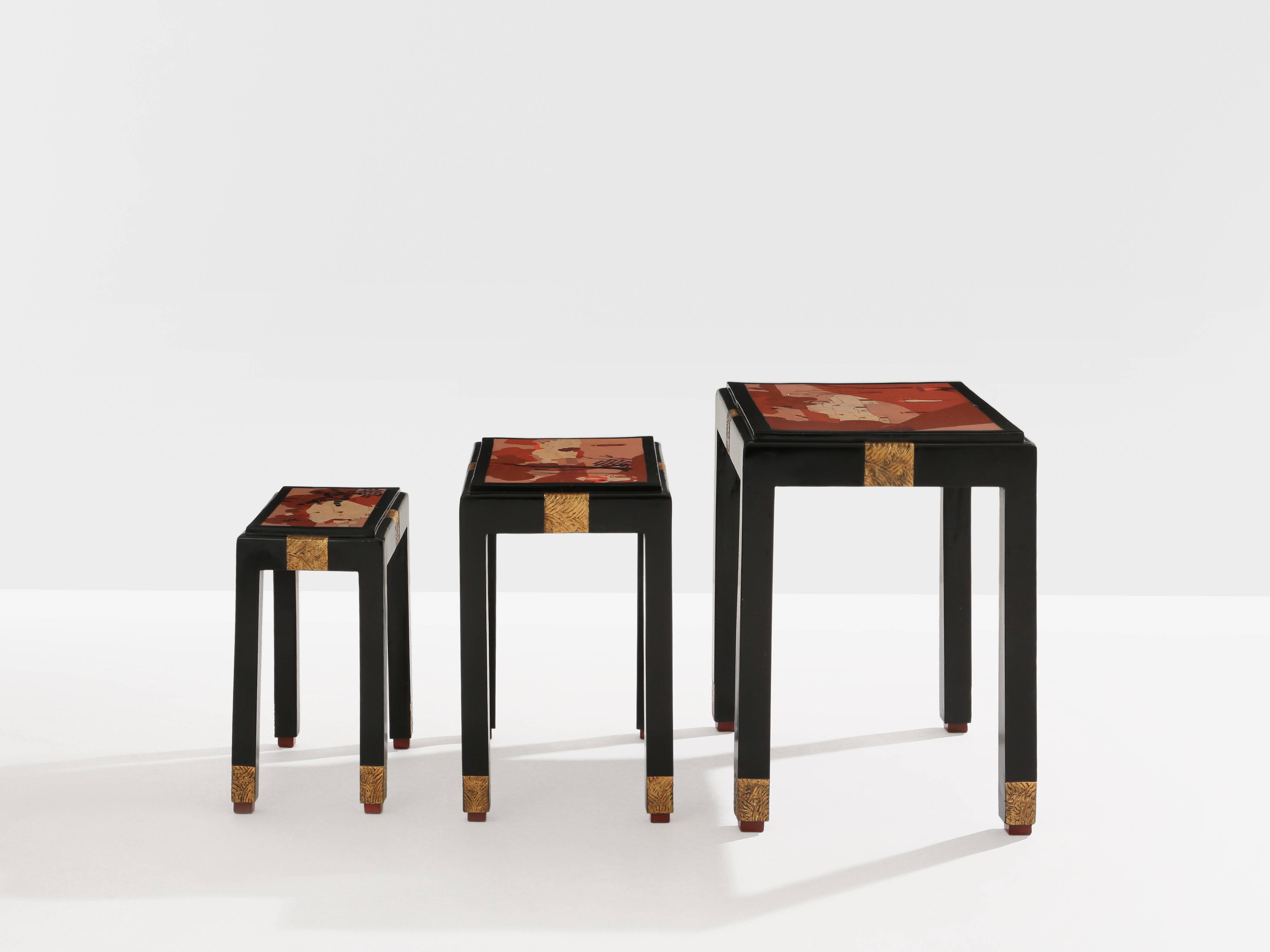 Set of three nesting tables with Asian decor, blackened wood, circa 1920.