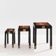Set of three nesting tables with Asian decor, blackened wood, circa 1920.