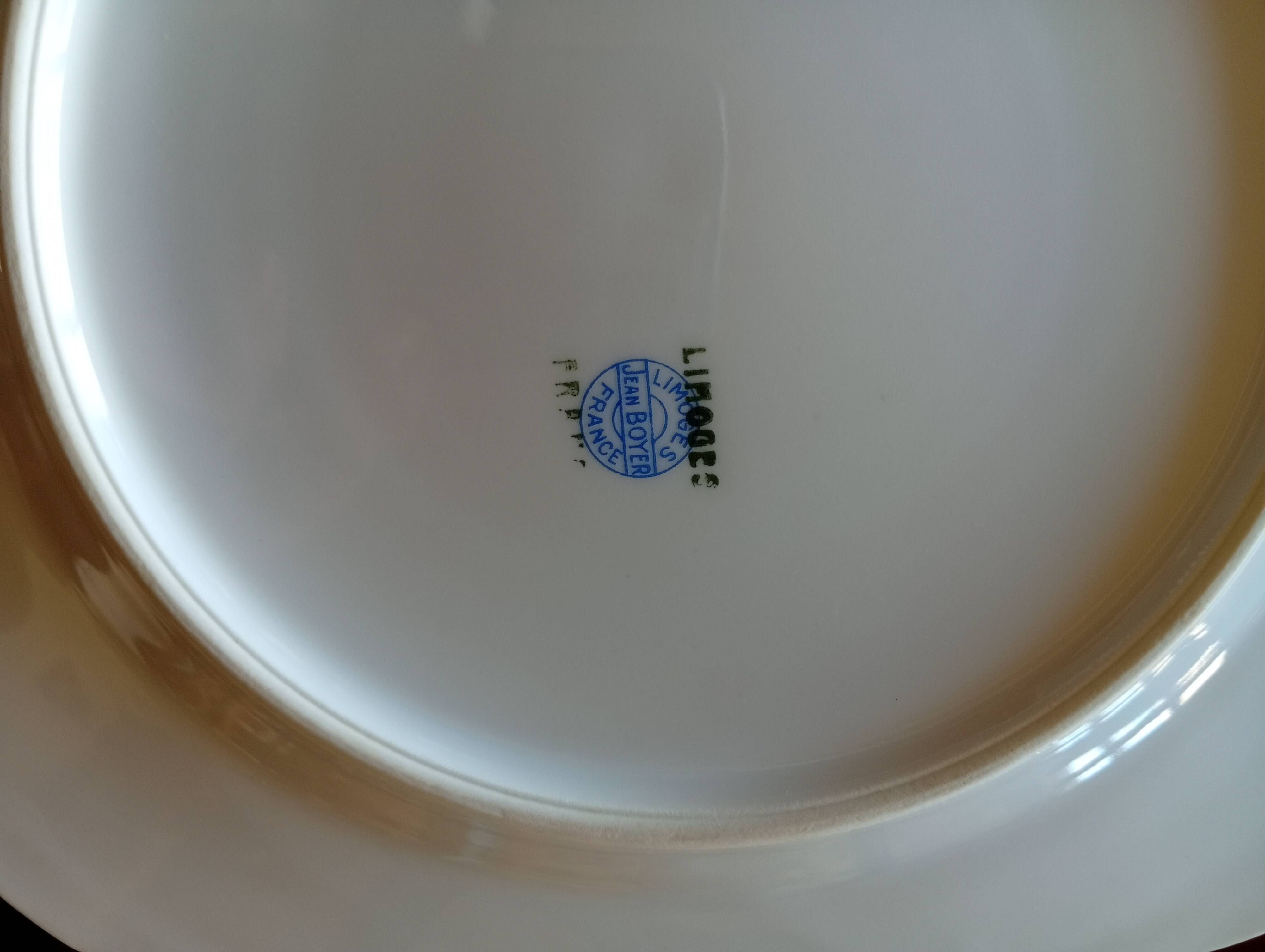 Jean BOYER Limoges FRANCE part of a white porcelain table service.