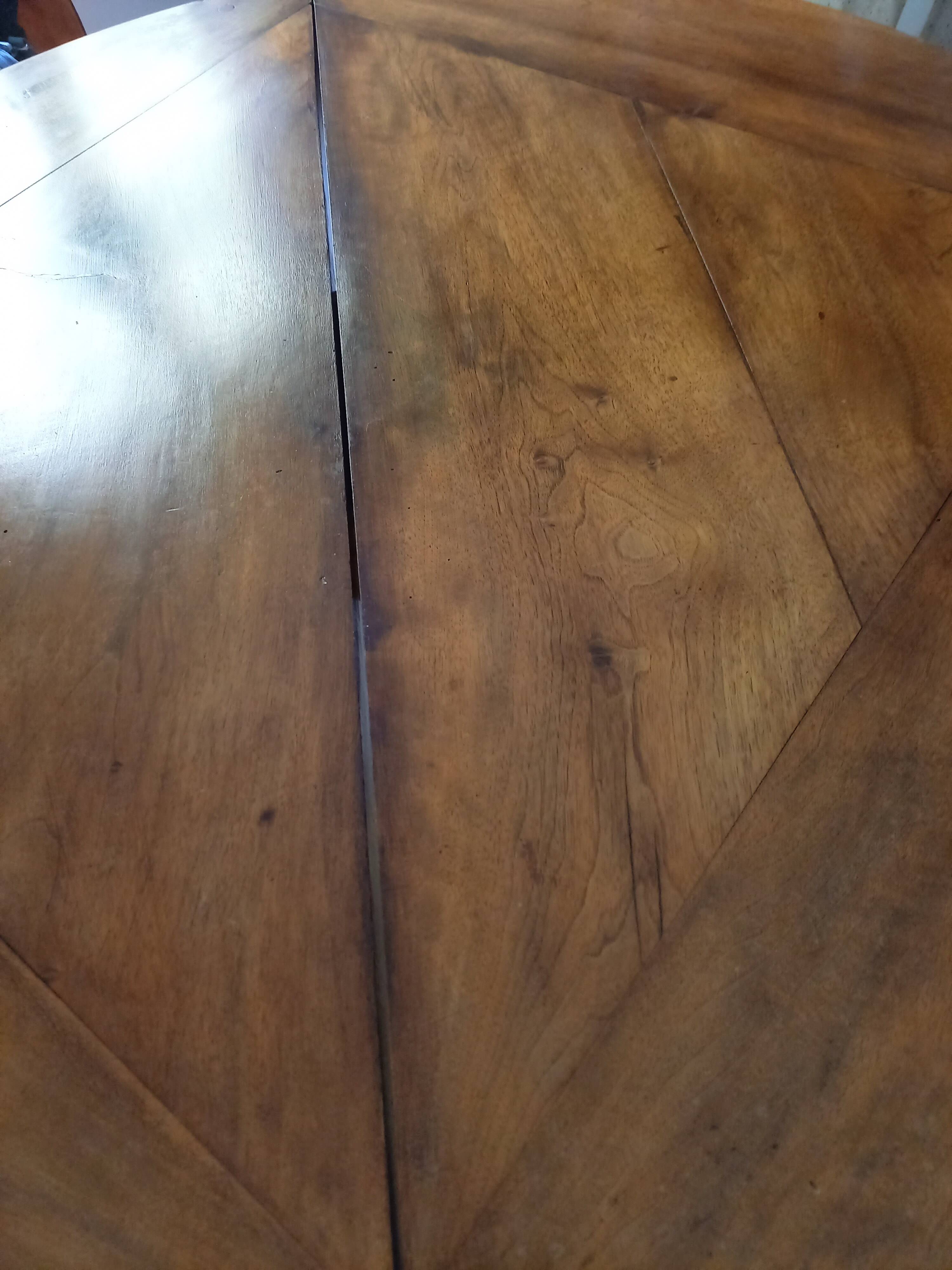 Antique half-moon walnut round table