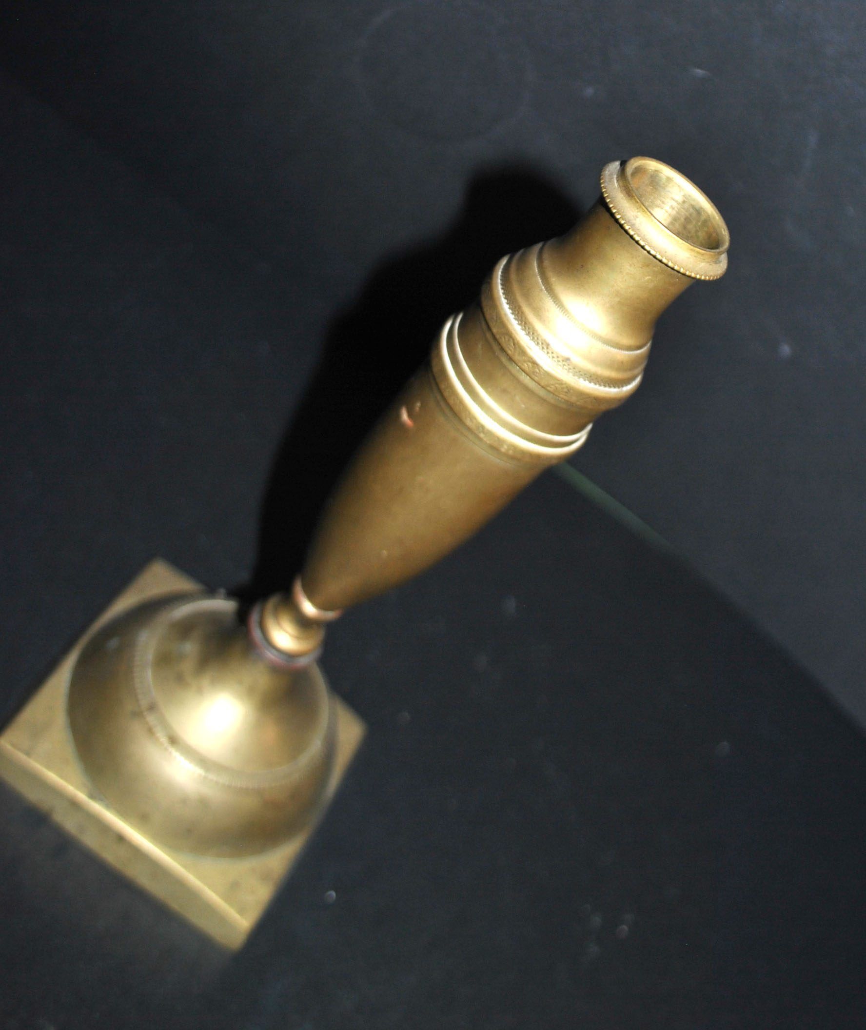 Antique baluster candlestick in bronze with hand-chiseled design.