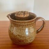 Large antique brown glazed stoneware jug with cork stopper.