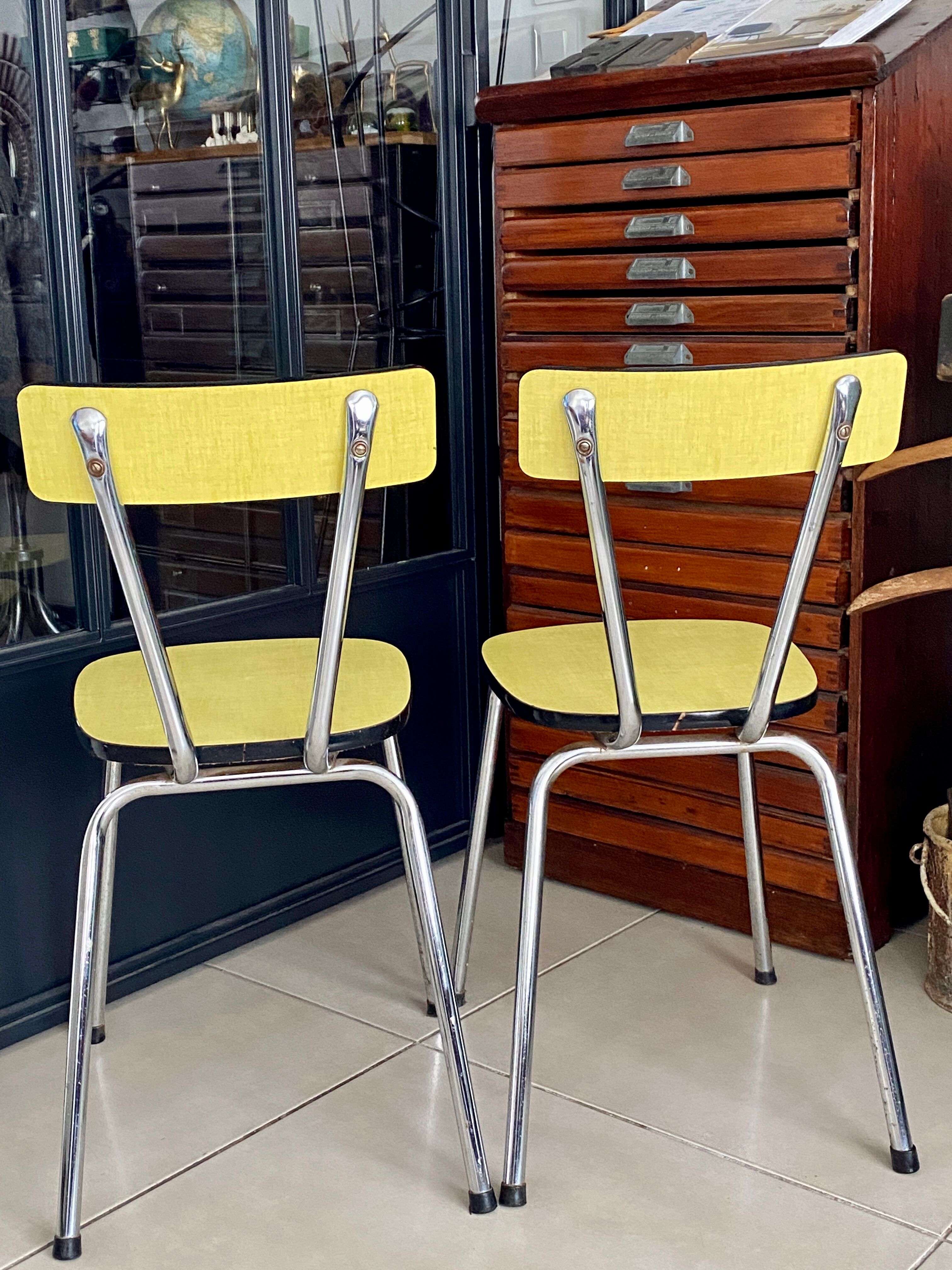 Pair of yellow formica chairs