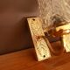 Pair of sconces in gold metal and tulip globe