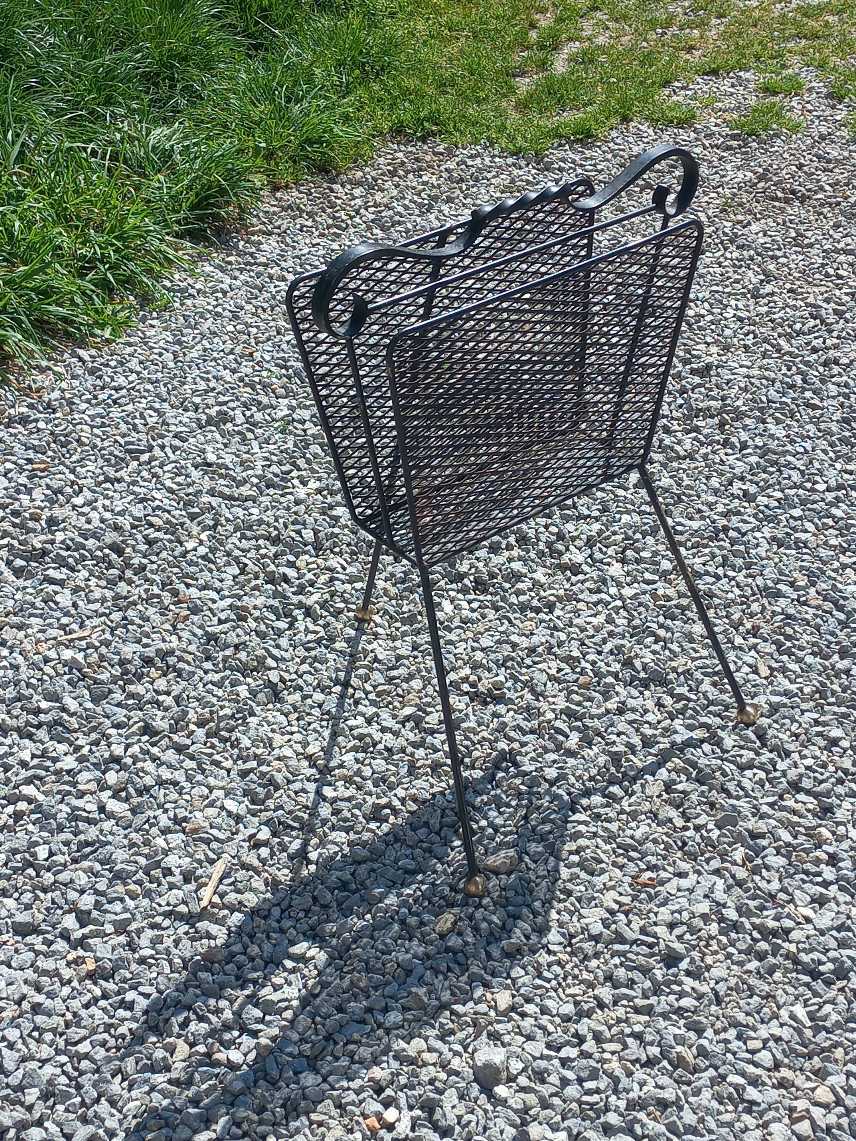 Perforated metal magazine rack from the 1960s.