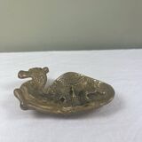 Brass pocket emptier