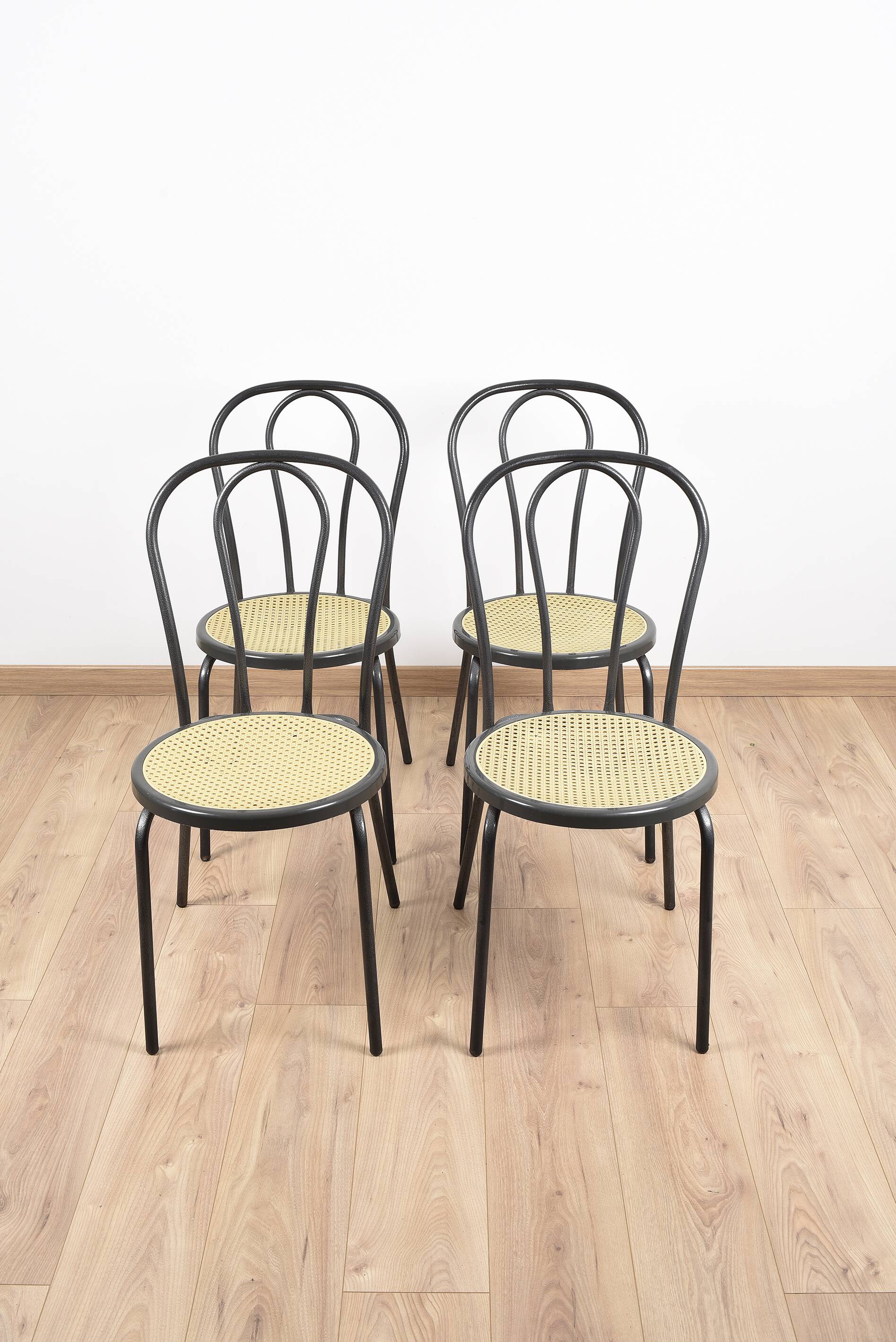 Bistro chairs, imitation cane seat.