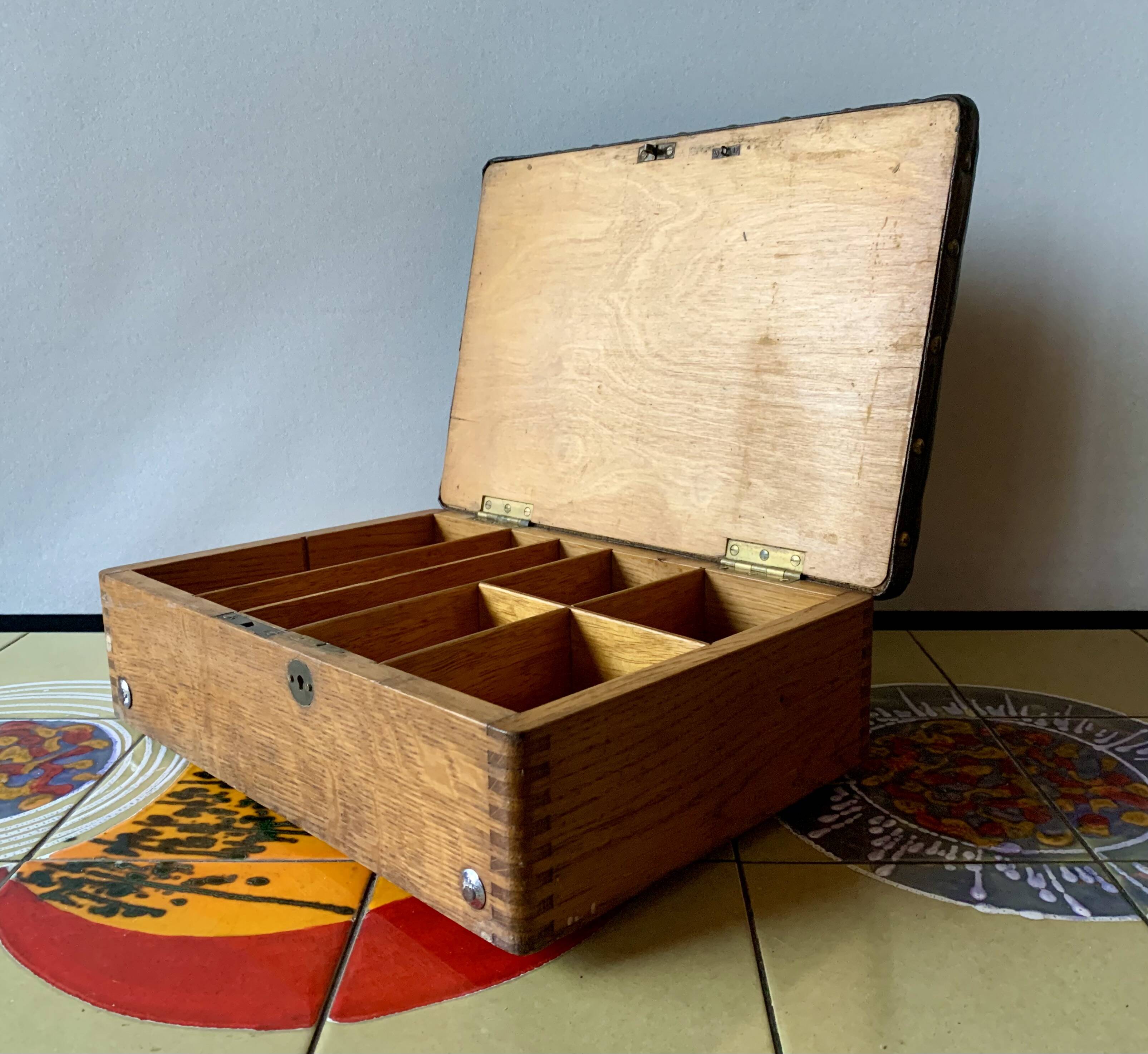Old foldable fisherman's stool in wood and leather