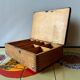 Old foldable fisherman's stool in wood and leather