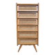 Vintage rattan chest of drawers with splayed legs from the 1950s.