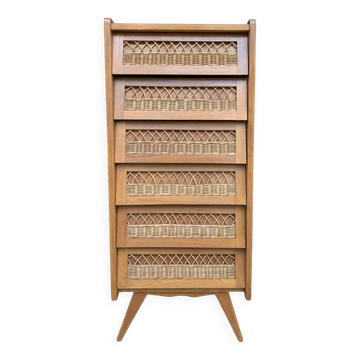 Vintage rattan chest of drawers with splayed legs from the 1950s.