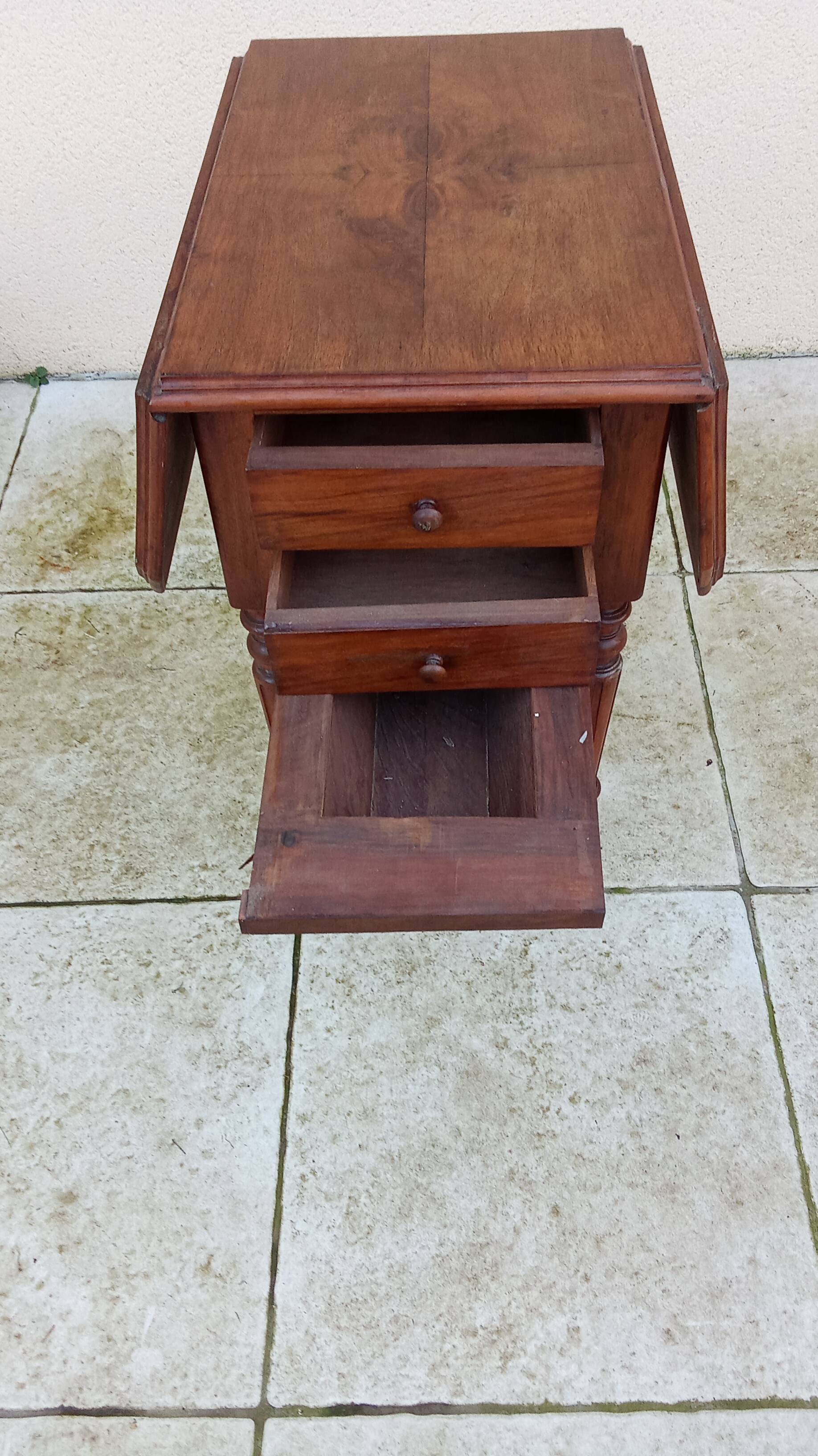 Antique small drop-leaf table from the 19th century.